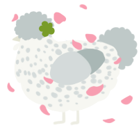 A white and silver chicken with a speckle pattern